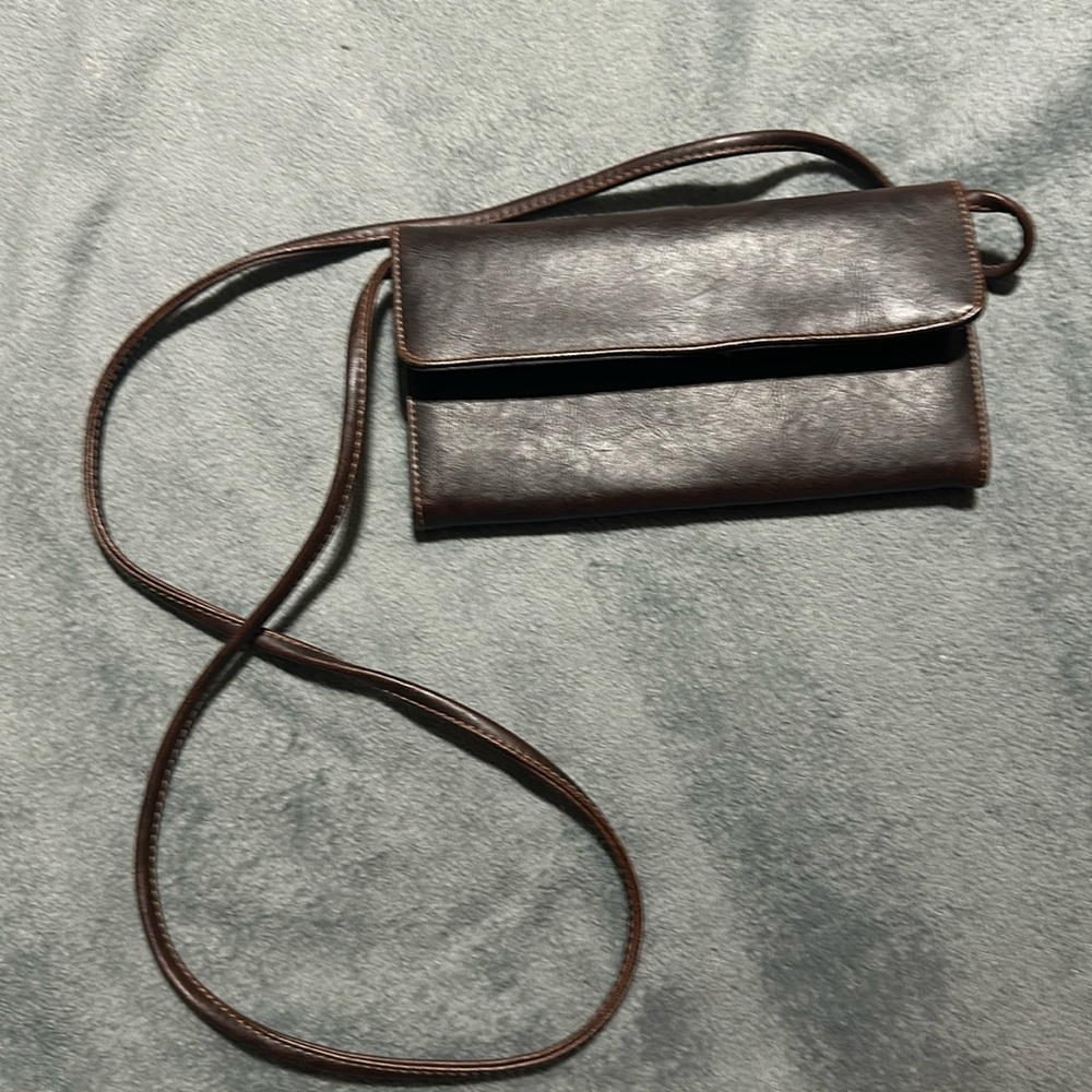 Brown clutch with removable strap.  Like new.